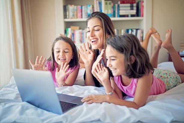 Mother And Her Daughters Are Making Video Call